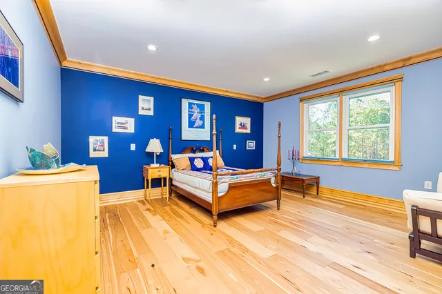 a bathroom with a granite countertop toilet sink and mirror