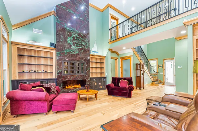 a living room with furniture or couch and a large window