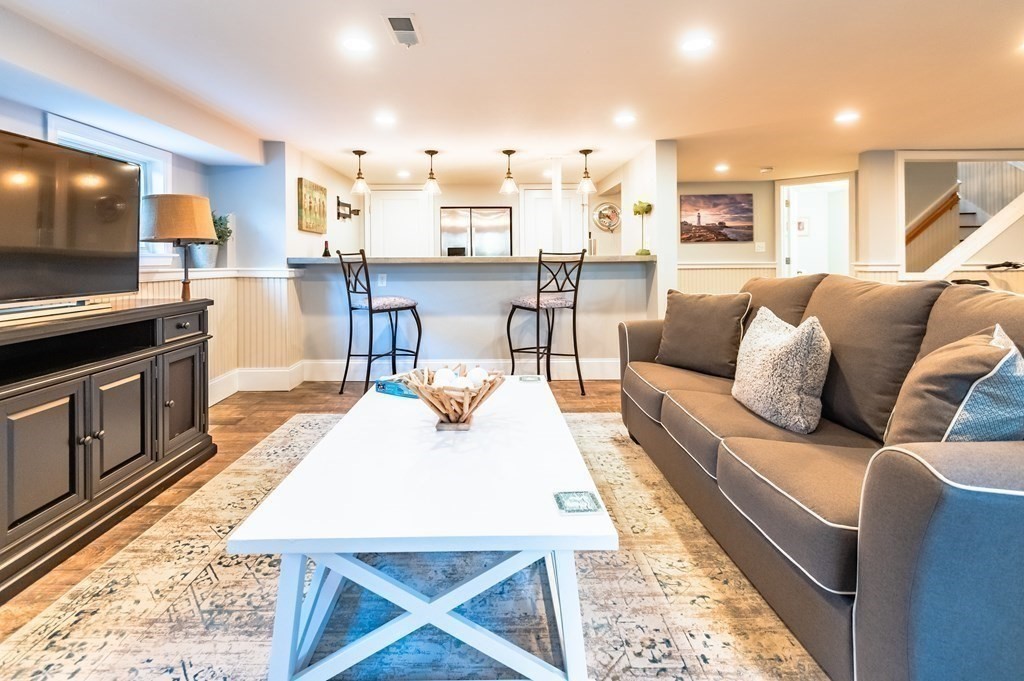 18 Damon Road Scituate, MA 02066 - Photo 12 of 25 a living room with furniture and a flat screen tv