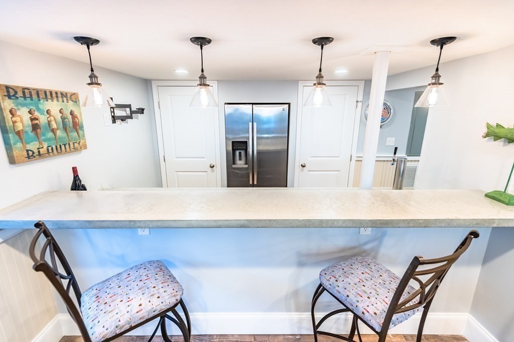 18 Damon Road Scituate, MA 02066 - Photo 13 of 25 a kitchen with a table and chairs