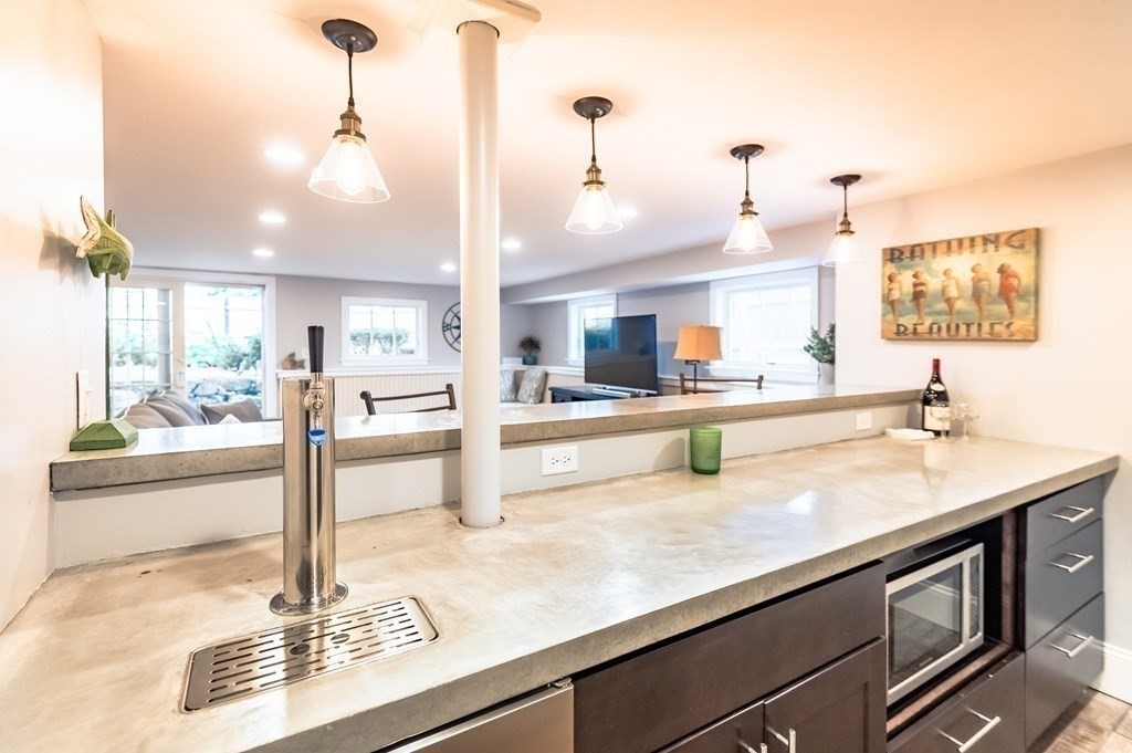 18 Damon Road Scituate, MA 02066 - Photo 14 of 25 a kitchen with stainless steel appliances granite countertop a sink and a counter top space