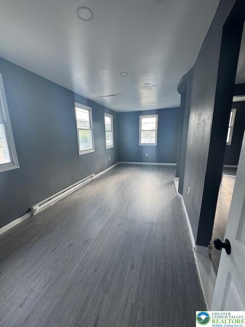 116 East Ridge Street, Unit 1 Coaldale, PA 18218 - Photo 2 of 7 an empty room with wooden floor and windows