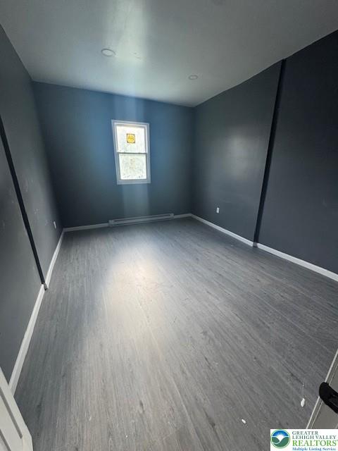 116 East Ridge Street, Unit 1 Coaldale, PA 18218 - Photo 7 of 7 an empty room with wooden floor and windows