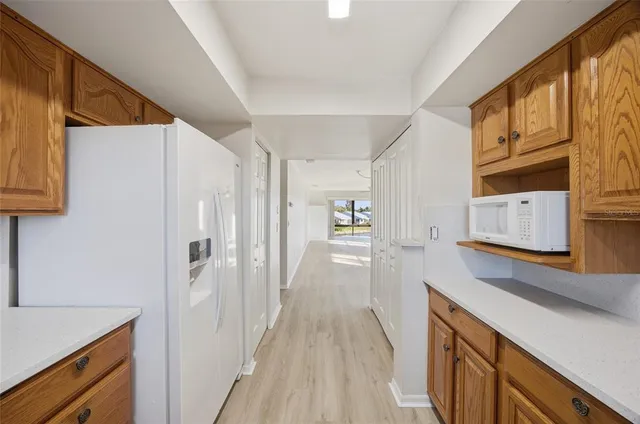 a view of a kitchen from the hallway