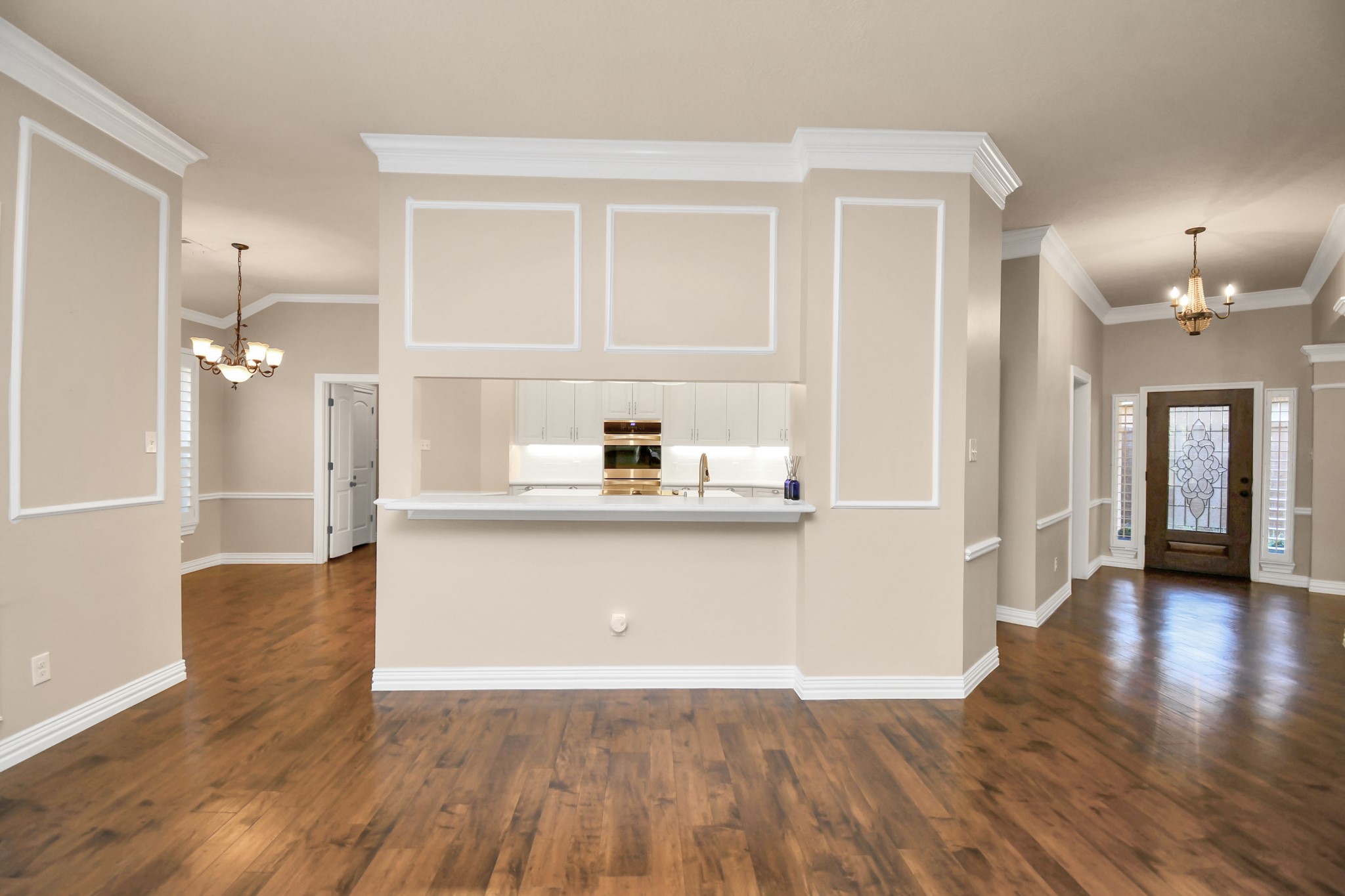 4411 Walham Court Houston, TX 77345 - Photo 13 of 46 a view of a hallway with wooden floor and a cabinet