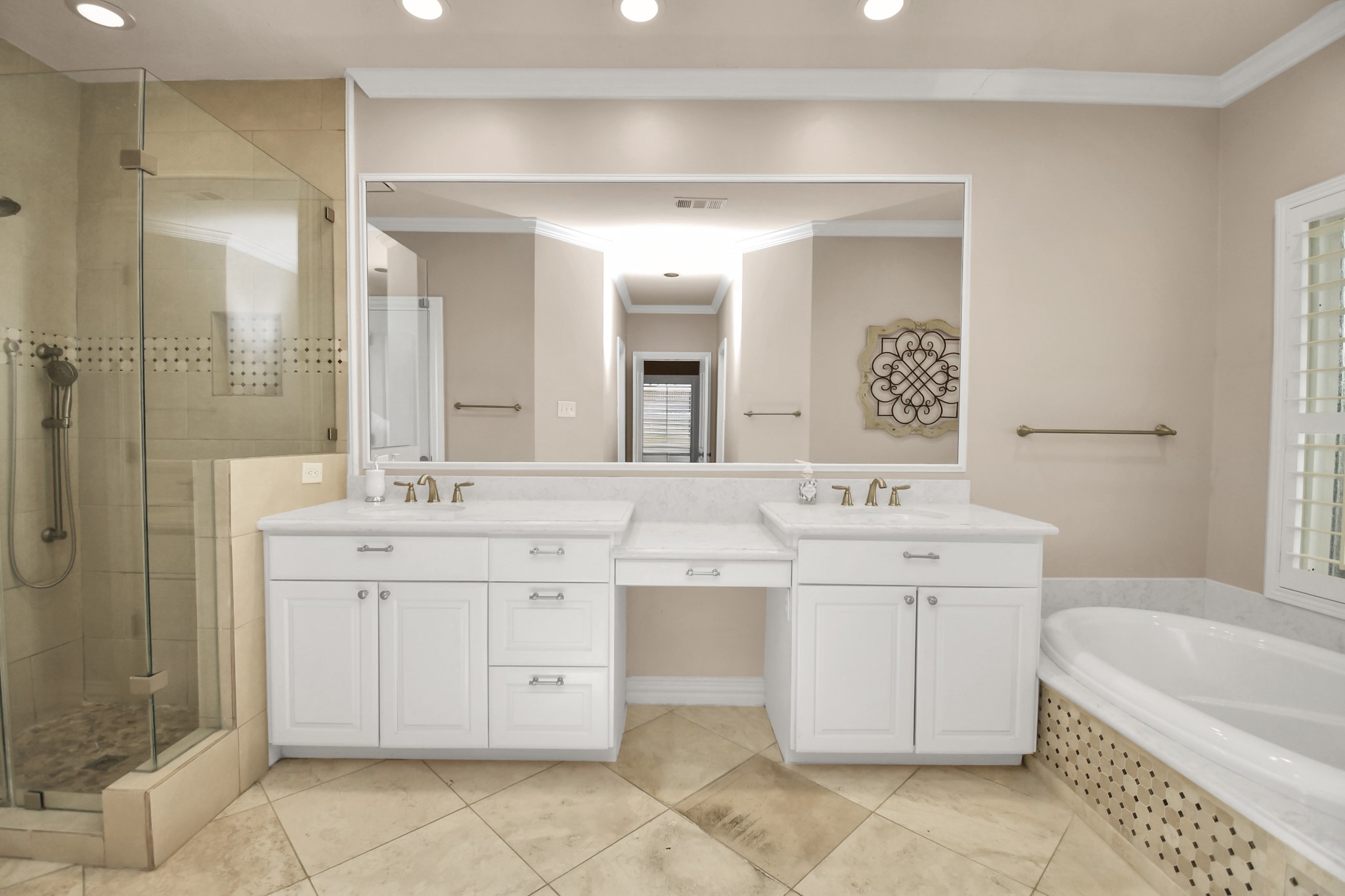 4411 Walham Court Houston, TX 77345 - Photo 31 of 46 a spacious bathroom with a double vanity sink mirror and bathtub