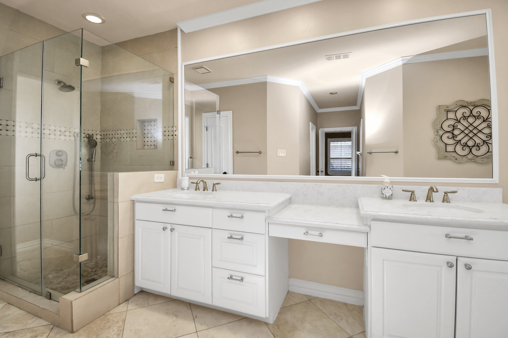 4411 Walham Court Houston, TX 77345 - Photo 32 of 46 a bathroom with a double vanity sink mirror and shower