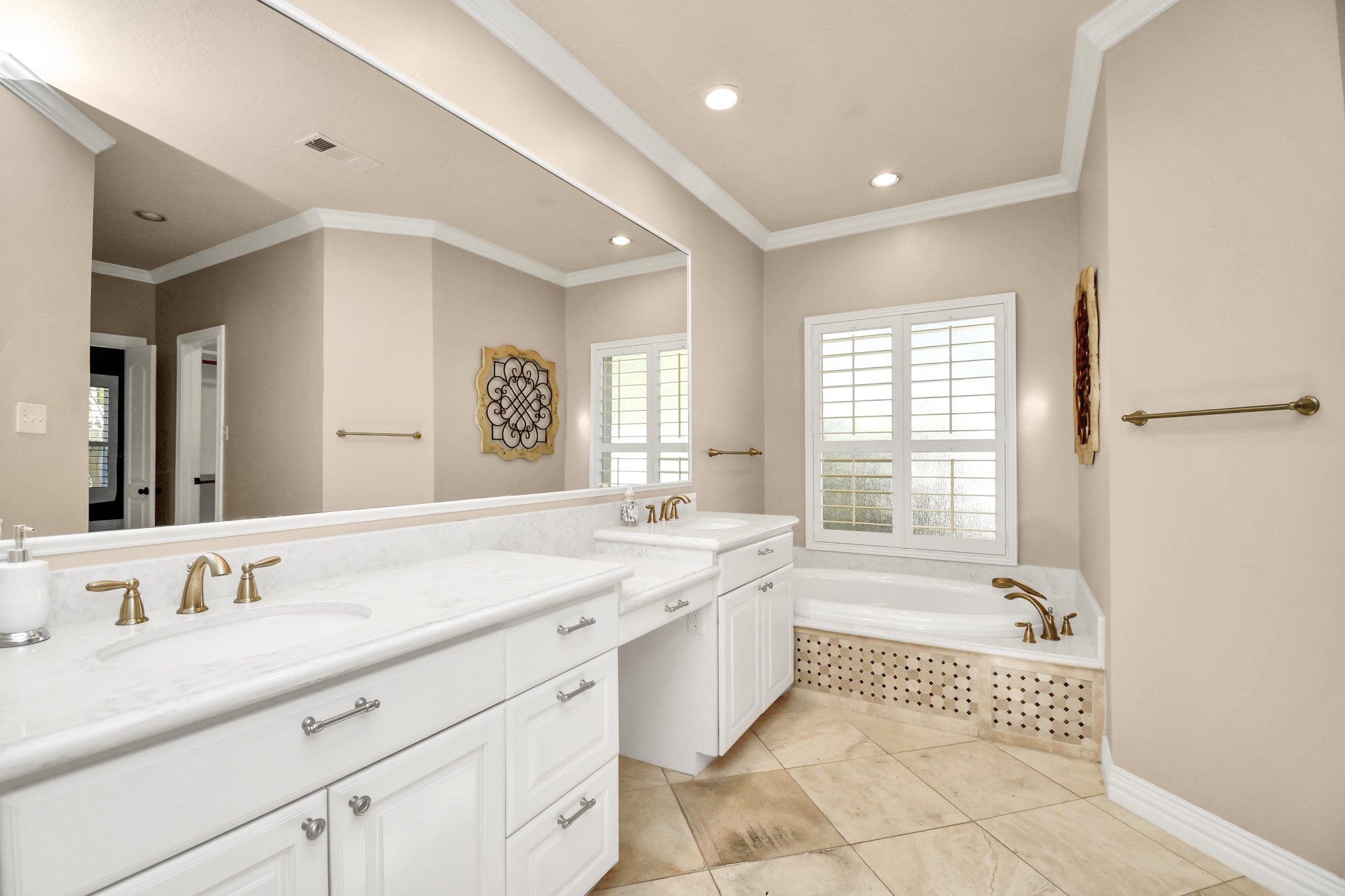 4411 Walham Court Houston, TX 77345 - Photo 33 of 46 a spacious bathroom with a granite countertop tub sink shower and mirror