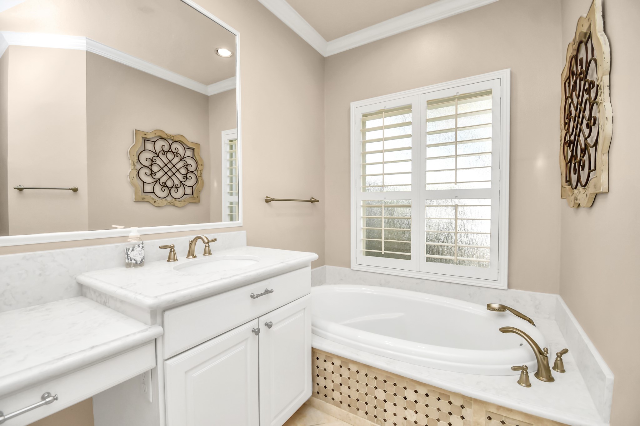 4411 Walham Court Houston, TX 77345 - Photo 35 of 46 a bathroom with a tub sink and mirror