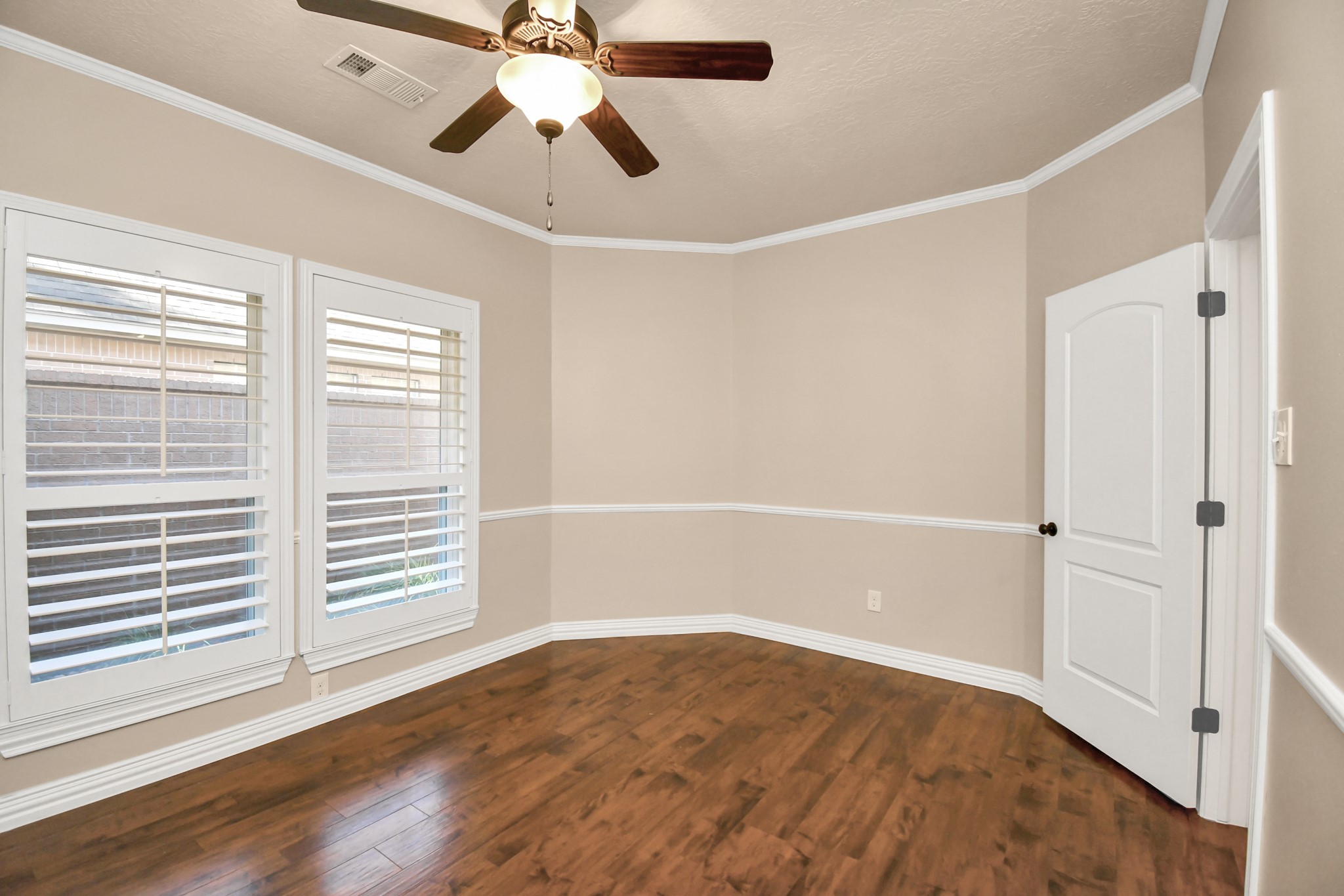 4411 Walham Court Houston, TX 77345 - Photo 38 of 46 a view of empty room with wooden floor and fan