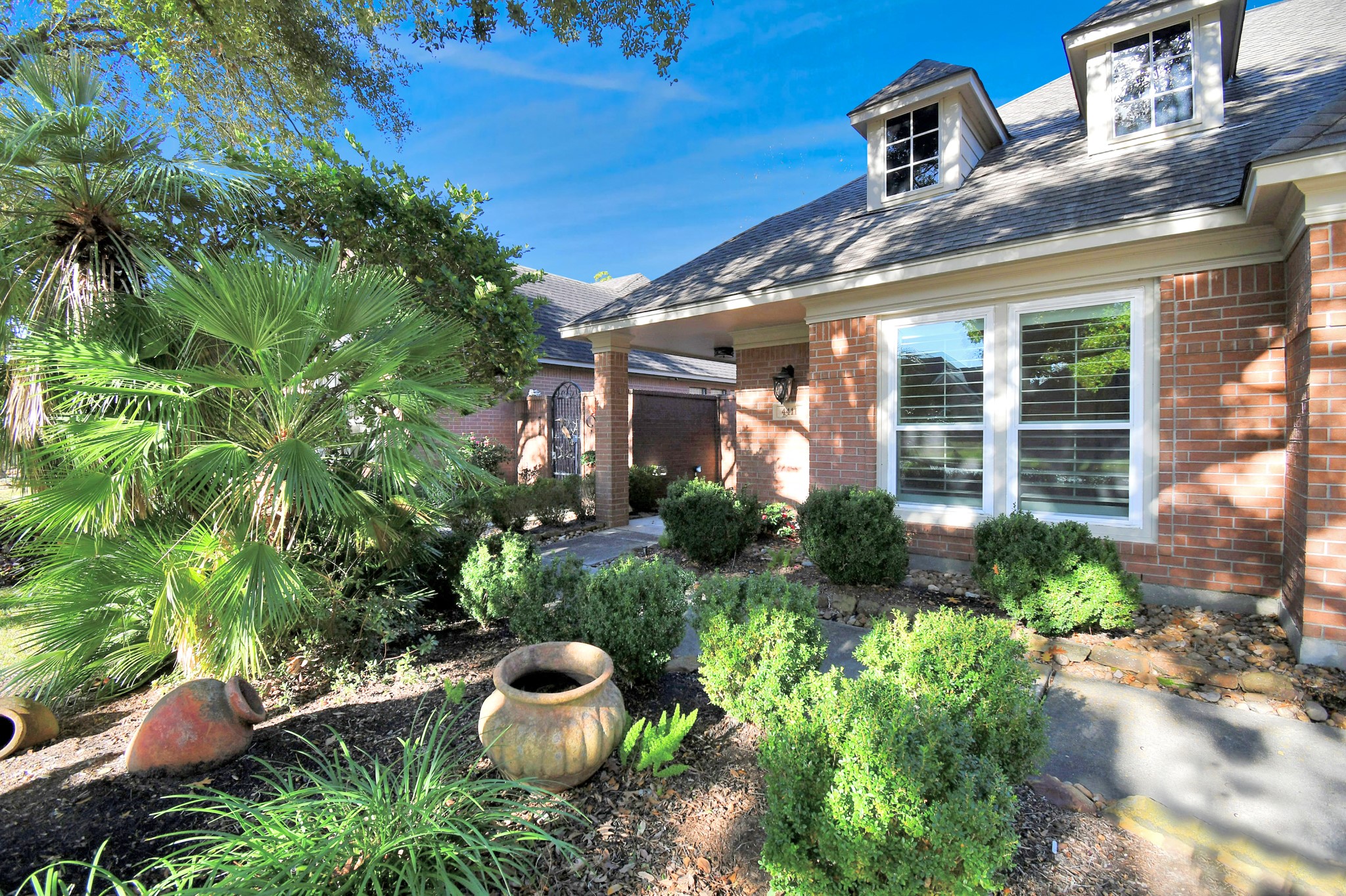4411 Walham Court Houston, TX 77345 - Photo 4 of 46 a view of a patio with table and chairs and potted plants