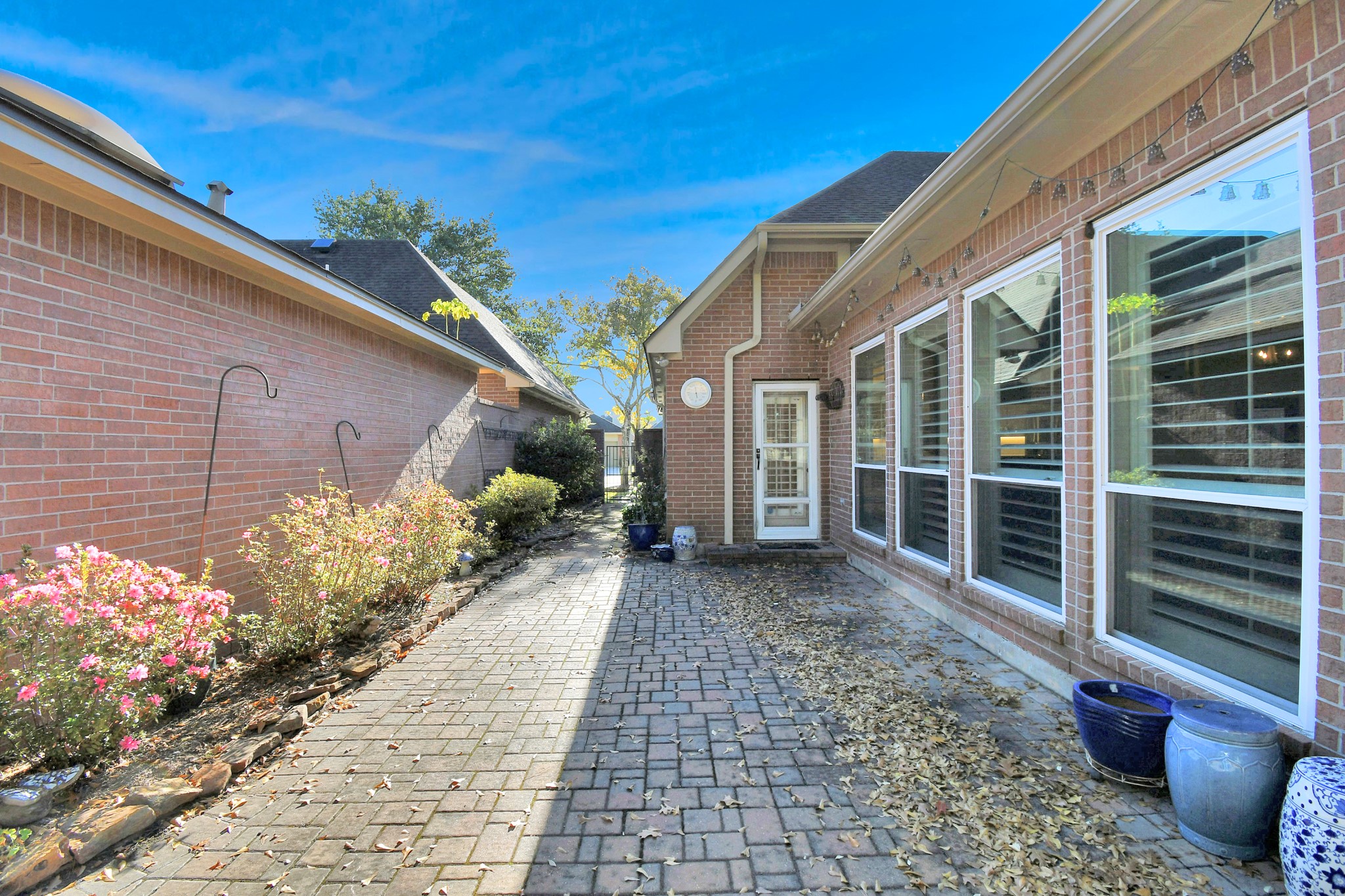 4411 Walham Court Houston, TX 77345 - Photo 42 of 46 a view of a house with a backyard