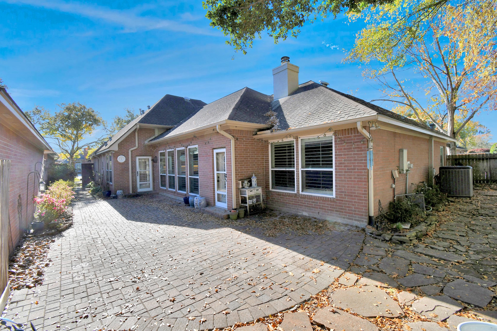 4411 Walham Court Houston, TX 77345 - Photo 44 of 46 a front view of a house with a garden