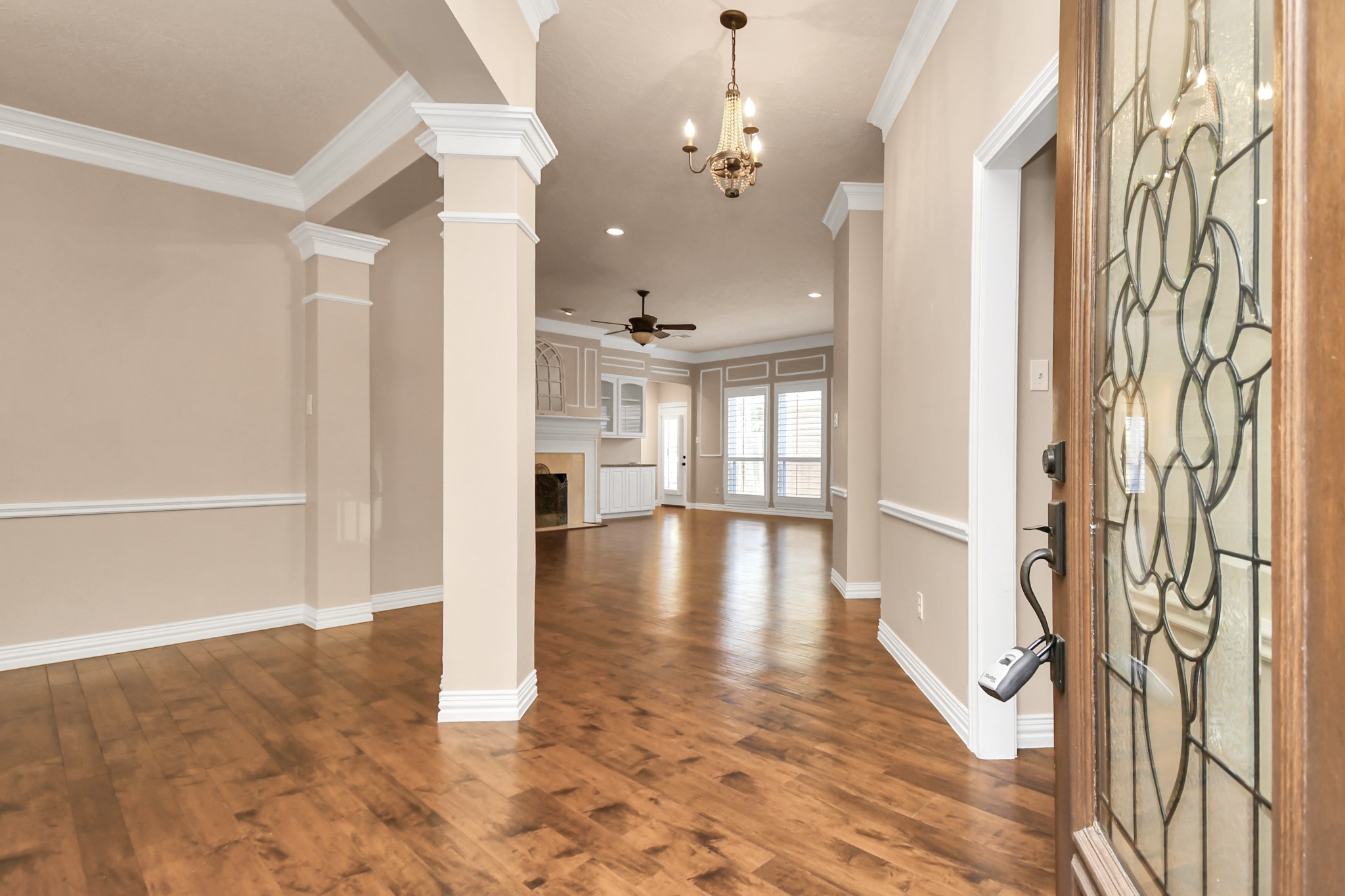 4411 Walham Court Houston, TX 77345 - Photo 6 of 46 a view of livingroom with hardwood floor and a ceiling fan