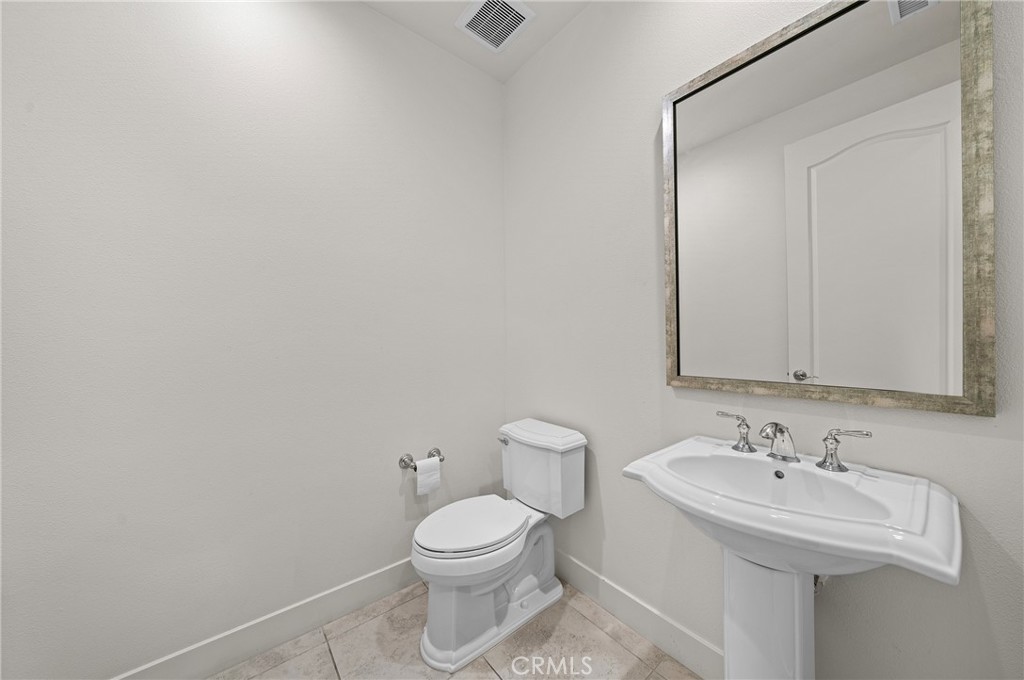 52 Eider Run Irvine, CA 92618 - Photo 22 of 46 a bathroom with a sink a toilet and mirror