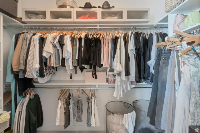 2319 North 3370 West Lehi, UT 84048 - Photo 11 of 30 Custom-built closet system featuring multiple hanging rods, integrated shelving, and upper enclosed storage