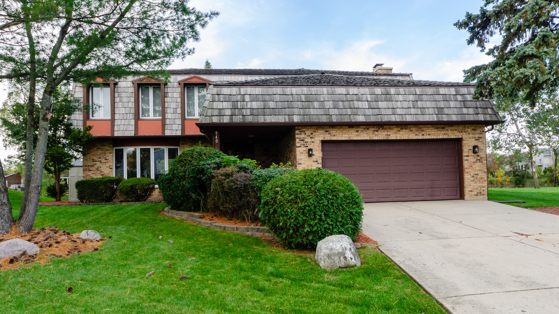 a front view of a house with garden