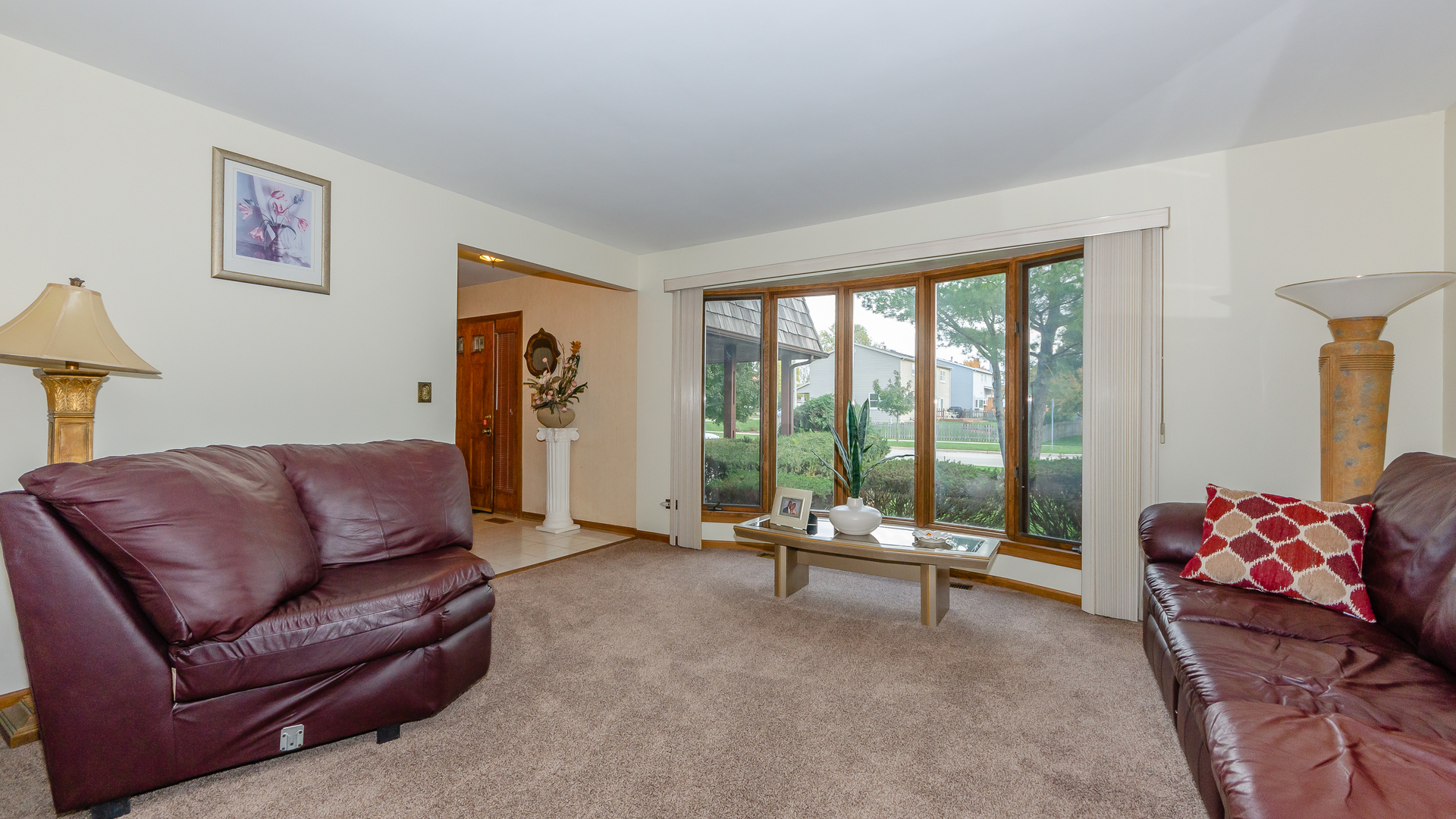 940 Gannon Drive Hoffman Estates, IL 60169 - Photo 5 of 20 a living room with furniture and large windows