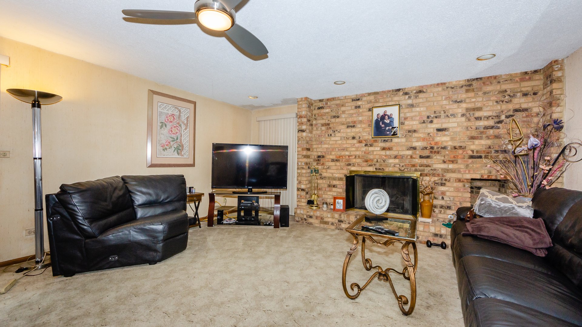940 Gannon Drive Hoffman Estates, IL 60169 - Photo 9 of 20 a living room with furniture and a flat screen tv