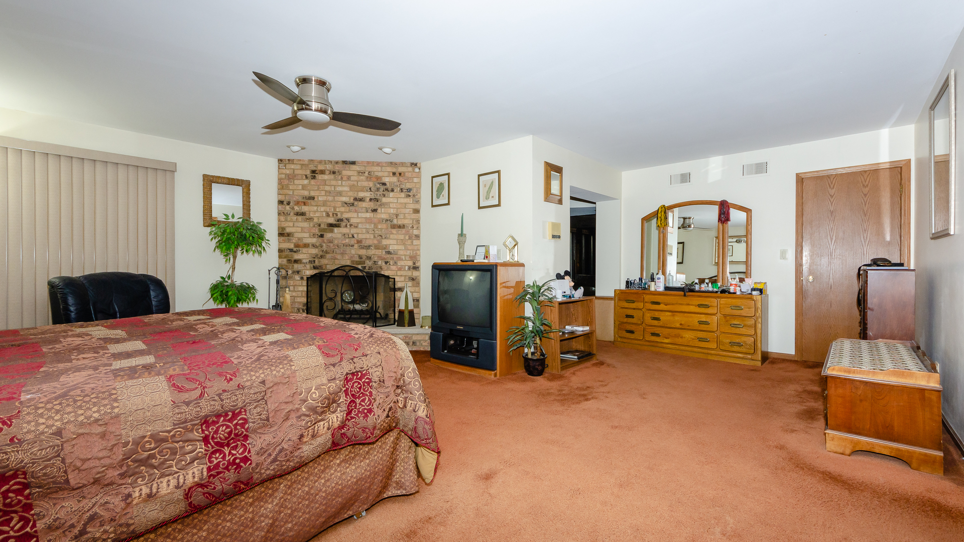 940 Gannon Drive Hoffman Estates, IL 60169 - Photo 10 of 20 a bedroom with a bed and fireplace