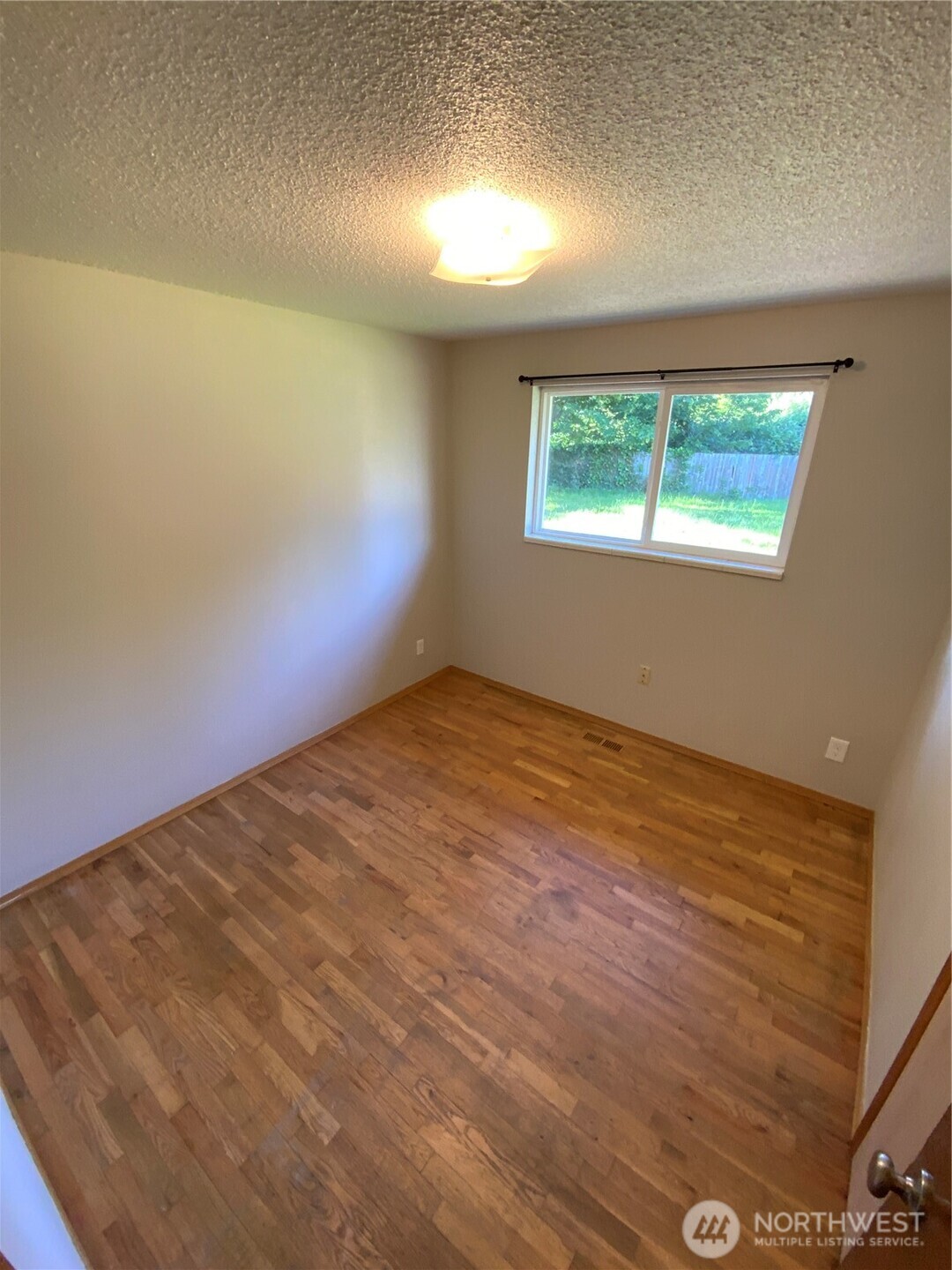 621 Brookdale Road East Tacoma, WA 98445 - Photo 11 of 14 an empty room with windows
