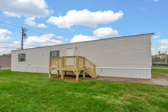 a view of a backyard with plants and a garden
