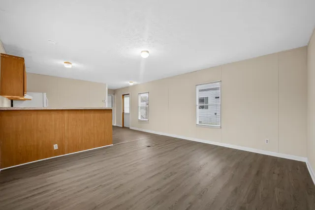 a view of a livingroom with wooden floor