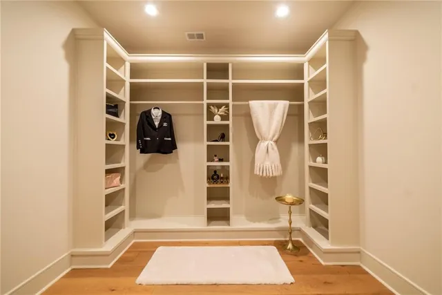 a front view of a house with a garden and yard