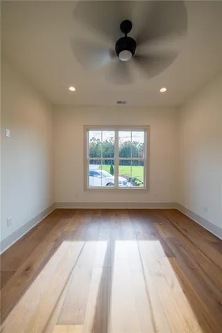 a view of front door with wooden floor and door