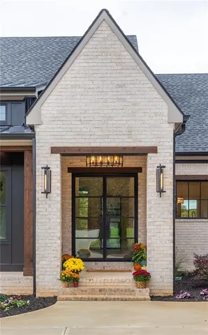 a kitchen with stainless steel appliances kitchen island a stove a sink and a refrigerator
