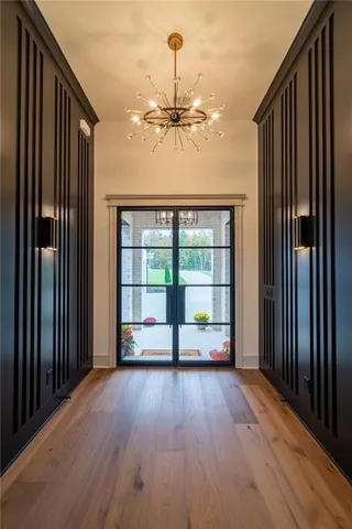 a kitchen with a sink appliances and cabinets