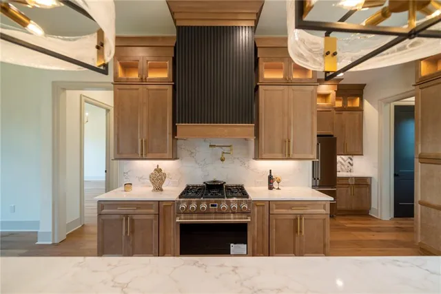 a living room with furniture wooden floor and a fireplace