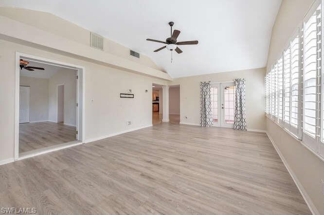 778 Broad Court South Naples, FL 34102 - Photo 22 of 36 a view of empty room with wooden floor and fan