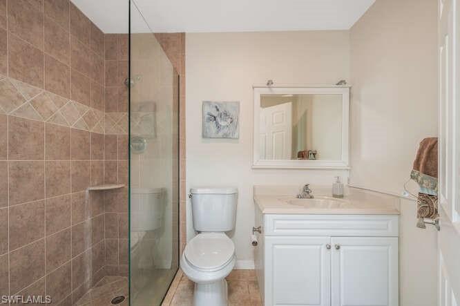 778 Broad Court South Naples, FL 34102 - Photo 24 of 36 a bathroom with a sink toilet and shower