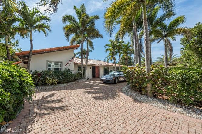 778 Broad Court South Naples, FL 34102 - Photo 3 of 36 a view of a house with a yard and plant