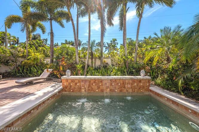 778 Broad Court South Naples, FL 34102 - Photo 34 of 36 a view of swimming pool with a yard