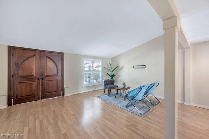 778 Broad Court South Naples, FL 34102 - Photo 6 of 36 a living room with furniture