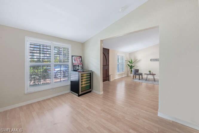 778 Broad Court South Naples, FL 34102 - Photo 9 of 36 a view of livingroom with furniture wooden floor and windows