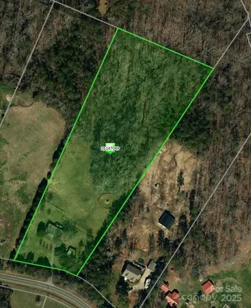 a view of a yard with potted plants