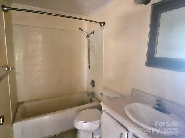 a bathroom with a toilet and a sink