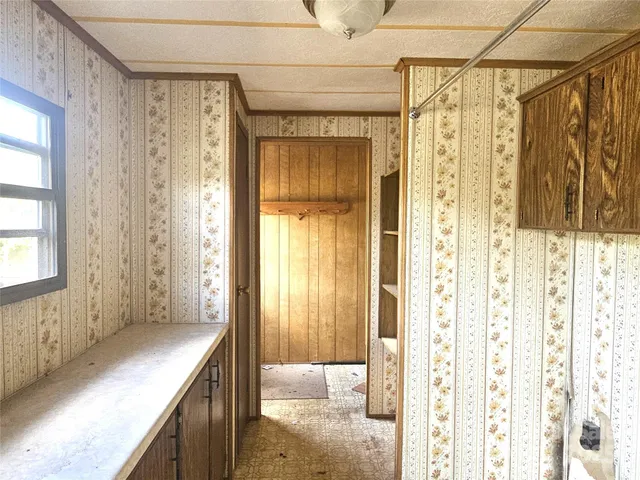 a bathroom with a shower and a sink