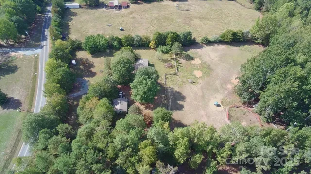 an aerial view of residential house with outdoor space and lake view