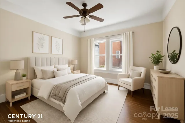 a bedroom with a bed a couch and a window