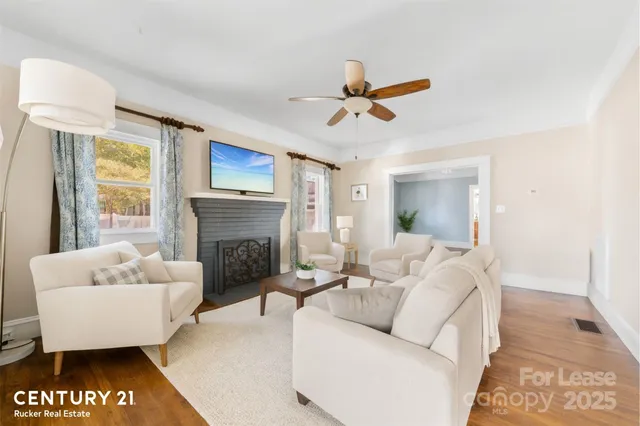 a living room with furniture and a fireplace