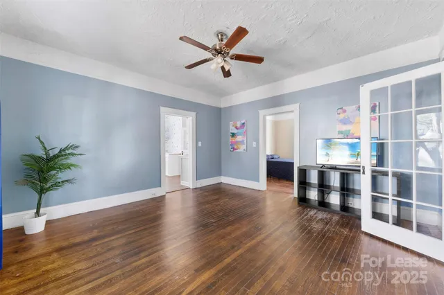 a view of workspace with wooden floor and window