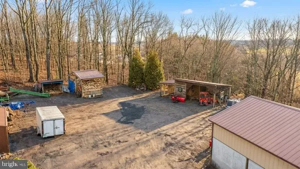 a view of a outdoor space with patio furniture and a fireplace