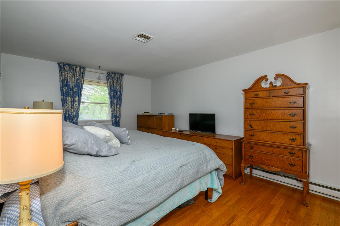 2516 Rachael Lane Orefield, PA 18069 - Photo 26 of 45 Hardwood floors and a well-lit window create a restful bedroom retreat.