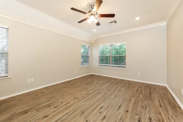 a bathroom with a granite countertop sink and a bathtub