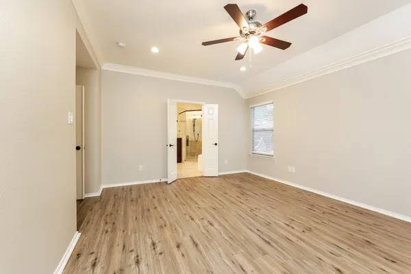 a bathroom with a tub a sink and mirror