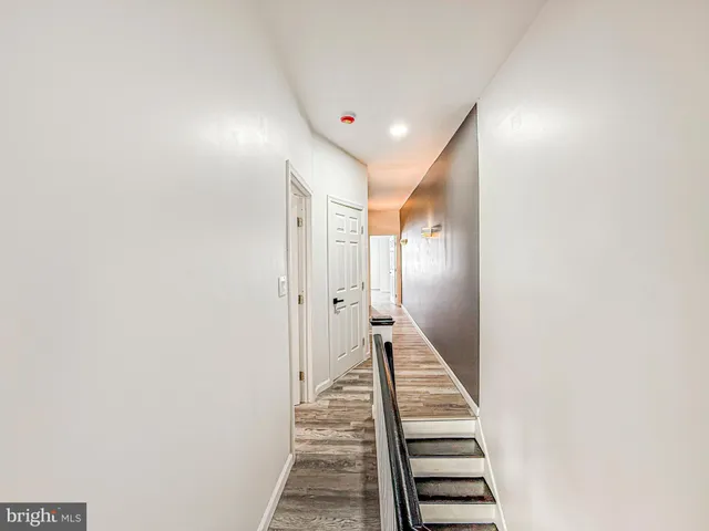 a view of a hallway with stairs